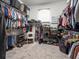 Spacious walk-in closet offering generous storage with organized shelving and hanging racks at 5216 Kernwood Ct, Palm Harbor, FL 34685