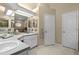 Bright bathroom with double sinks and plenty of counter space and updated fixtures at 5520 Terrain De Golf Dr, Lutz, FL 33558
