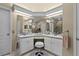 Spacious bathroom with dual sinks, white cabinetry, makeup vanity, and a separate glass enclosed shower at 5520 Terrain De Golf Dr, Lutz, FL 33558