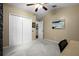 Bedroom featuring neutral carpet, a vaulted ceiling with ceiling fan, and double door closets at 5520 Terrain De Golf Dr, Lutz, FL 33558
