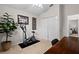 Bedroom featuring a workout machine, closet, neutral carpeting, and lots of natural light at 5520 Terrain De Golf Dr, Lutz, FL 33558