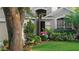 Close up of a house with a well manicured front yard and front door at 5520 Terrain De Golf Dr, Lutz, FL 33558