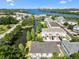 Aerial of waterfront community with pond and views of city skyline at 616 Wheaton Trent Pl, Tampa, FL 33619