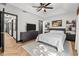 Spacious bedroom with trey ceilings, herringbone wood floors, and modern decor at 616 Wheaton Trent Pl, Tampa, FL 33619