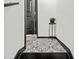Stylish tiled entryway featuring unique patterned tiles and elegant decor at 616 Wheaton Trent Pl, Tampa, FL 33619