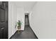 Bright entryway hallway with plant and staircase leading up at 616 Wheaton Trent Pl, Tampa, FL 33619