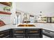 Modern kitchen with a gold sink and modern faucet with bright countertops and an open concept at 616 Wheaton Trent Pl, Tampa, FL 33619