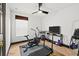 Bright workout room with an exercise bike, treadmill, and a ceiling fan at 616 Wheaton Trent Pl, Tampa, FL 33619