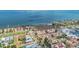 Serene aerial shot of the waterfront neighborhood, highlighting the yellow condos and marina nearby at 6404 Mayra Shores Ln, Apollo Beach, FL 33572