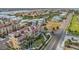 Aerial view showcasing the beautiful yellow condo community with marina access and lush landscaping at 6404 Mayra Shores Ln, Apollo Beach, FL 33572