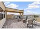 An outdoor kitchen and seating arrangements on a tiled balcony at 6404 Mayra Shores Ln, Apollo Beach, FL 33572