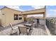 An outdoor kitchen and seating arrangements on a tiled balcony at 6404 Mayra Shores Ln, Apollo Beach, FL 33572