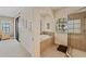 Bathroom view with tub and walk-in shower, and sliding door to the Primary bedroom at 6404 Mayra Shores Ln, Apollo Beach, FL 33572