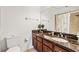 Bathroom featuring a toilet, large mirror, and single vanity at 6404 Mayra Shores Ln, Apollo Beach, FL 33572