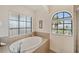 Bathroom featuring a large soaking tub with tile surround and a walk in shower at 6404 Mayra Shores Ln, Apollo Beach, FL 33572
