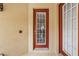 A glass-paneled front door allows natural light into the home's entryway at 6404 Mayra Shores Ln, Apollo Beach, FL 33572