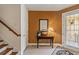 Charming entryway with a decorative mirror and a table, leading to stairs and offering a welcoming ambiance at 6404 Mayra Shores Ln, Apollo Beach, FL 33572