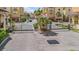 View of the well-maintained, gated entrance to the neighborhood with tropical plants at 6404 Mayra Shores Ln, Apollo Beach, FL 33572