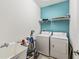 Laundry room featuring a utility sink and a washer and dryer at 6404 Mayra Shores Ln, Apollo Beach, FL 33572