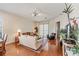 Comfortable living room with hardwood floors, ceiling fan, sliding doors, and a cozy seating area at 6404 Mayra Shores Ln, Apollo Beach, FL 33572