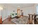Bright living room with hardwood floors, a ceiling fan, neutral paint, and comfortable seating at 6404 Mayra Shores Ln, Apollo Beach, FL 33572
