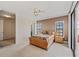 Main bedroom boasting carpeted floors, windows with blinds, and ensuite access at 6404 Mayra Shores Ln, Apollo Beach, FL 33572