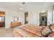 Main bedroom showcasing double doors to the ensuite bathroom and walk in closet at 6404 Mayra Shores Ln, Apollo Beach, FL 33572