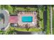Overhead aerial view of the community pool and jacuzzi surrounded by lounge chairs at 6404 Mayra Shores Ln, Apollo Beach, FL 33572