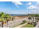 Relax on the grass near the water and palm trees for nice scenery at 6404 Mayra Shores Ln, Apollo Beach, FL 33572