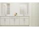 Bright bathroom with double vanity, white cabinets, and modern fixtures at 6483 Propel Run, New Port Richey, FL 34655
