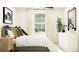 Comfortable bedroom with a large window, bright natural light and modern decor at 6483 Propel Run, New Port Richey, FL 34655