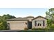 Charming single-story home with a neutral color palette, a two-car garage, and landscaped yard at 7783 Wheat Stone Dr, Zephyrhills, FL 33540