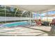 Outdoor living at its finest: screened-in pool with plenty of room for entertaining at 8388 Maltby Rd, Spring Hill, FL 34606