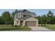 Charming two-story home with attached garage, landscaped yard, and neutral color palette at 8506 Sea Ray Run, Parrish, FL 34219