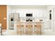 Modern kitchen featuring stainless steel appliances, white cabinetry, and a center island with bar stool seating at 8506 Sea Ray Run, Parrish, FL 34219