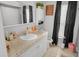 Bathroom featuring a granite vanity top and shower/tub combo at 8712 Ashbury Dr, Hudson, FL 34667