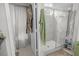 Bathroom featuring a glass-enclosed shower and adjacent storage space at 8712 Ashbury Dr, Hudson, FL 34667