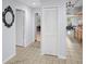 Bright hallway with tile flooring, closet and views to the kitchen at 8712 Ashbury Dr, Hudson, FL 34667