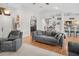 Open-concept living area featuring high ceilings and a view into the kitchen at 8712 Ashbury Dr, Hudson, FL 34667