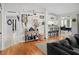 Living area leading to the dining room and kitchen, with stylish decor and laminate flooring at 8712 Ashbury Dr, Hudson, FL 34667