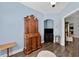 A bedroom featuring blue walls and an antique wooden dresser next to dark wood floors with an area rug at 9412 Azalea Ridge Cir, Tampa, FL 33647