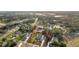 Aerial view of the property, showcasing its spacious lot and surrounding landscaping with a red property line at 10117 Breezy Pines Ct, Weeki Wachee, FL 34613