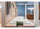 Bright bathroom features a soaking tub with elegant fixtures and tiled surround at 10117 Breezy Pines Ct, Weeki Wachee, FL 34613