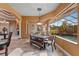 Open dining area with large windows offering views of the pool and outdoor area at 10117 Breezy Pines Ct, Weeki Wachee, FL 34613