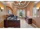 Functional home office featuring a large desk, tray ceiling, and natural light, offering a productive workspace at 10117 Breezy Pines Ct, Weeki Wachee, FL 34613