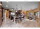 Open-concept kitchen featuring a center island, tiled floors, and adjacent breakfast nook with bench seating at 10117 Breezy Pines Ct, Weeki Wachee, FL 34613