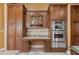 Kitchen featuring stainless steel appliances, custom cabinetry, and granite countertops at 10117 Breezy Pines Ct, Weeki Wachee, FL 34613