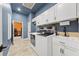 Laundry room with large capacity washer and dryer, cabinet space, and utility sink at 10117 Breezy Pines Ct, Weeki Wachee, FL 34613