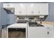 Laundry room with large capacity washer and dryer, cabinet space, and utility sink at 10117 Breezy Pines Ct, Weeki Wachee, FL 34613