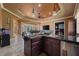 Open-concept living room with high ceilings, wet bar, and seamless access to the outdoor pool area at 10117 Breezy Pines Ct, Weeki Wachee, FL 34613